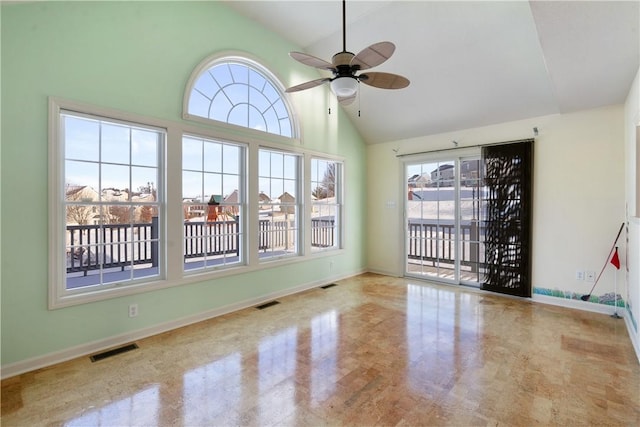 unfurnished sunroom with ceiling fan and lofted ceiling