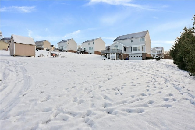 view of yard layered in snow