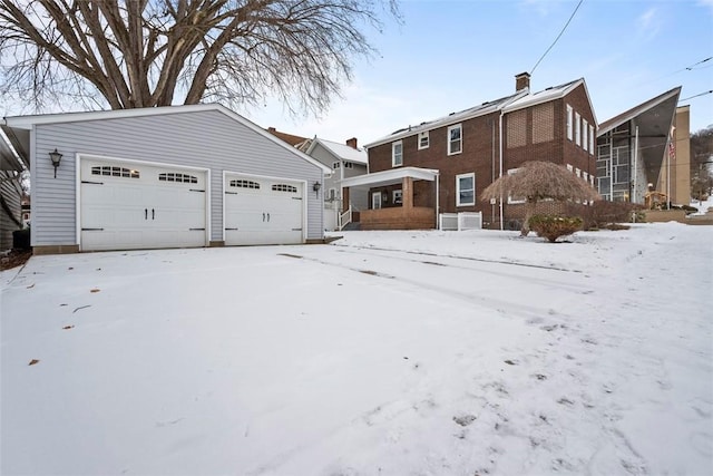 exterior space featuring an outbuilding and a garage