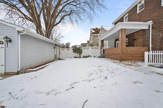 view of yard layered in snow