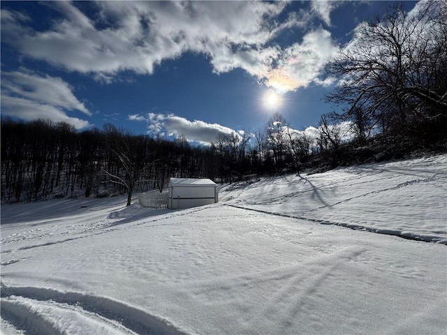 view of yard layered in snow