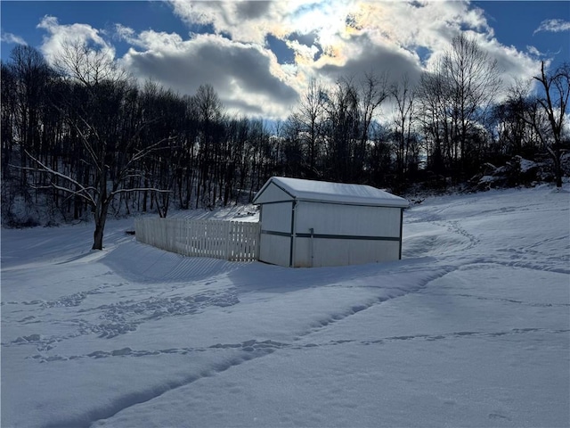 yard covered in snow with an outdoor structure