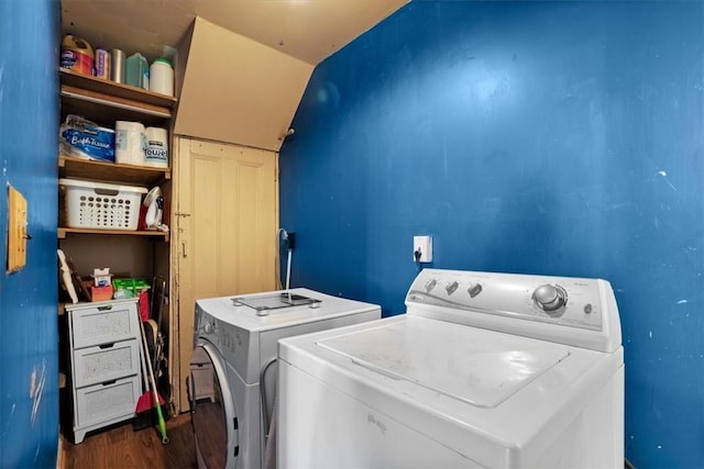 washroom featuring dark hardwood / wood-style floors and washing machine and dryer