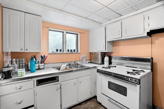 kitchen featuring white cabinetry, sink, and white range with gas cooktop