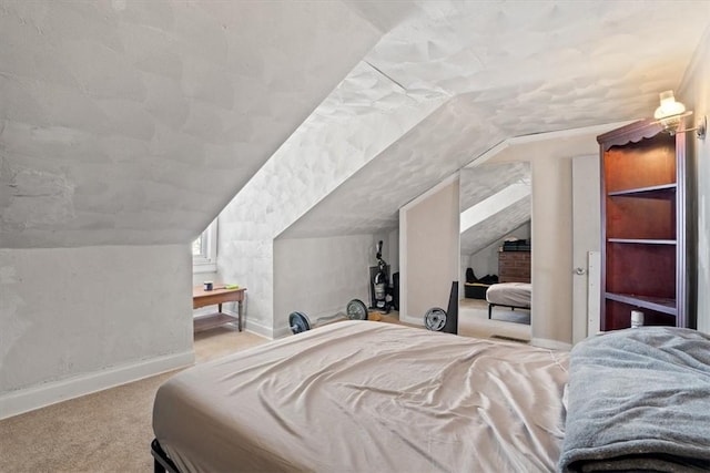 carpeted bedroom featuring lofted ceiling