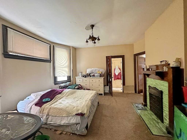 carpeted bedroom featuring a chandelier