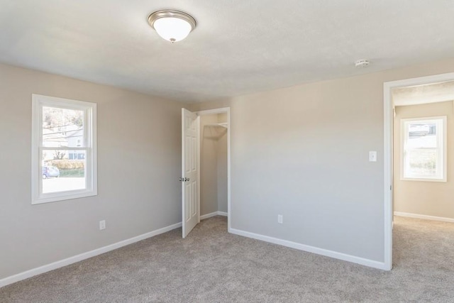 empty room featuring light carpet