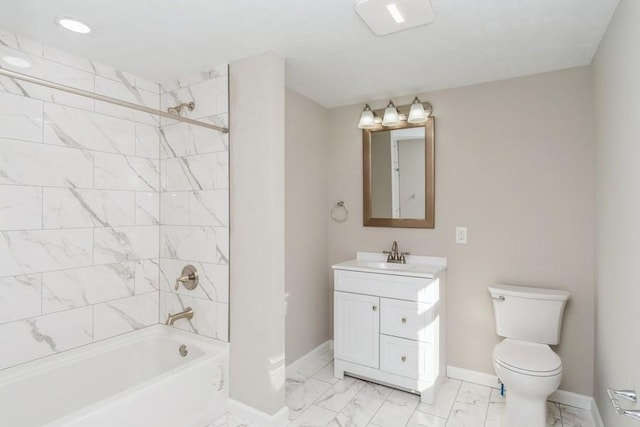 full bathroom with toilet, vanity, and tiled shower / bath