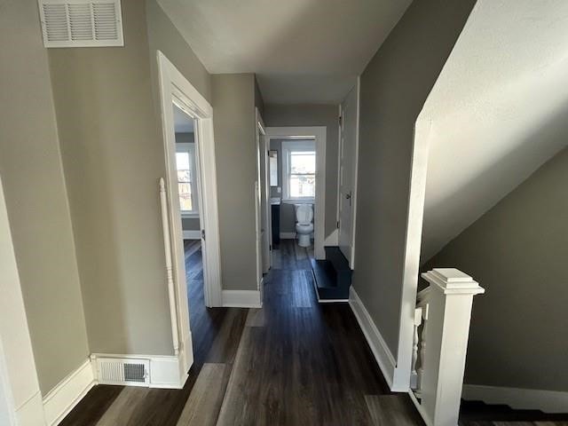 hall with dark hardwood / wood-style floors