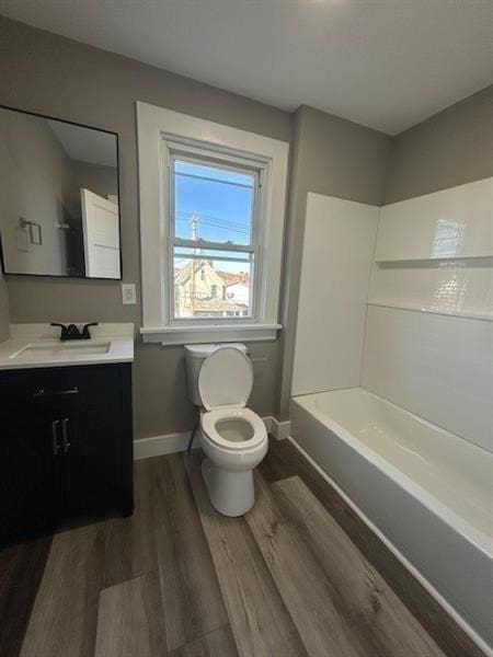 full bathroom featuring shower / bathing tub combination, vanity, toilet, and wood-type flooring