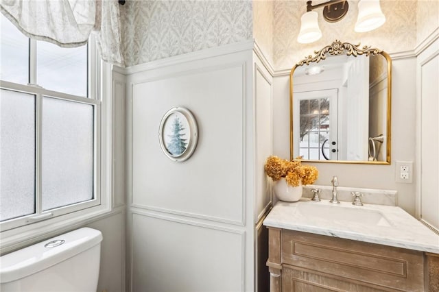 bathroom with vanity and toilet