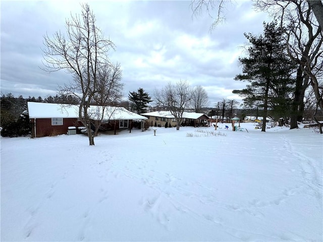 view of yard covered in snow