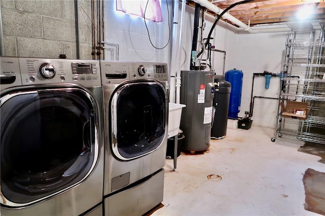 washroom featuring separate washer and dryer and electric water heater