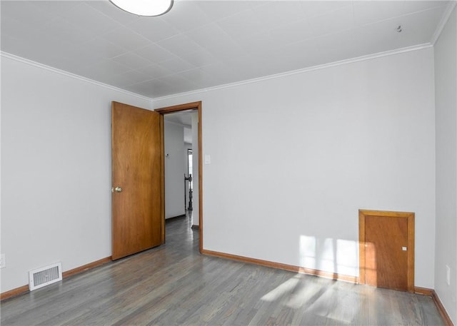 unfurnished room with crown molding and wood-type flooring