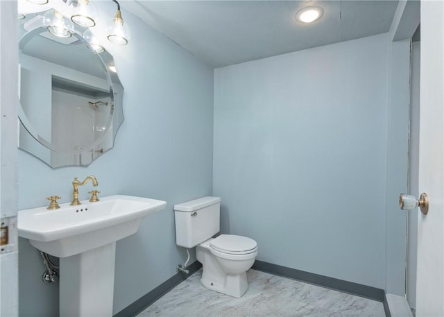 bathroom featuring toilet and sink