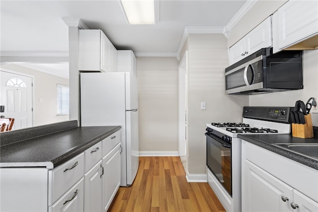 kitchen with crown molding, light hardwood / wood-style flooring, white cabinets, and white appliances