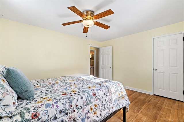 bedroom with hardwood / wood-style flooring and ceiling fan