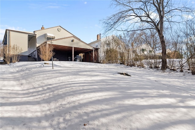 view of snow covered house