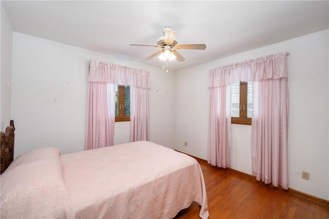 bedroom featuring light hardwood / wood-style floors and ceiling fan