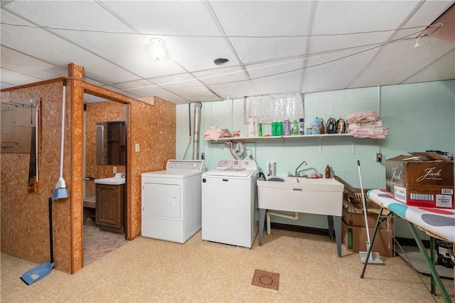 laundry room featuring washer and dryer and sink