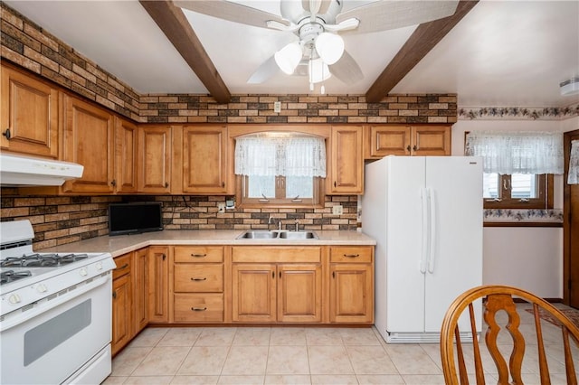 kitchen with light tile patterned flooring, white appliances, ceiling fan, and sink