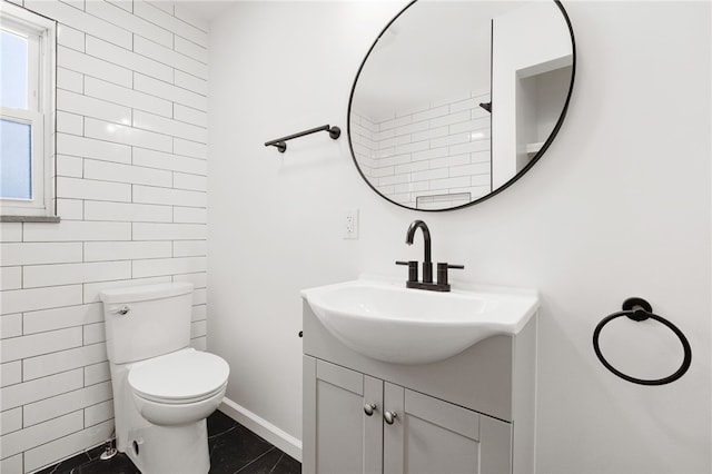 bathroom with vanity and toilet