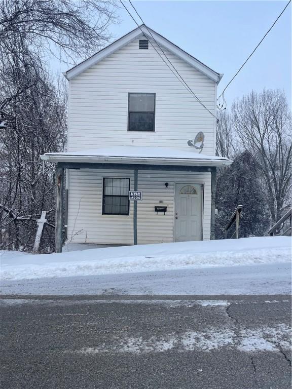 view of snow covered garage