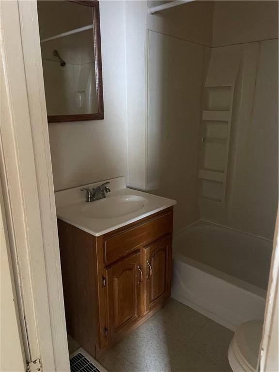 full bathroom with toilet, vanity, and bathing tub / shower combination