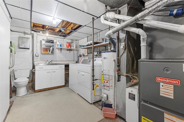 interior space featuring independent washer and dryer and water heater