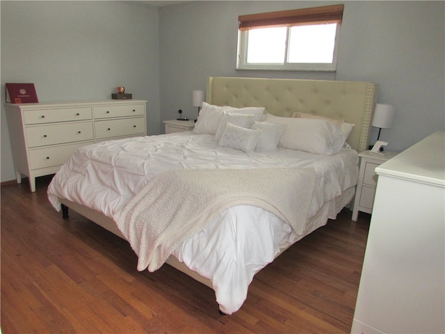 bedroom featuring dark wood-type flooring