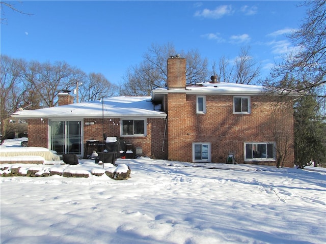 view of snow covered house