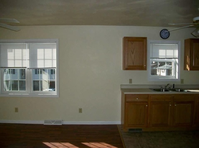 kitchen with ceiling fan and sink