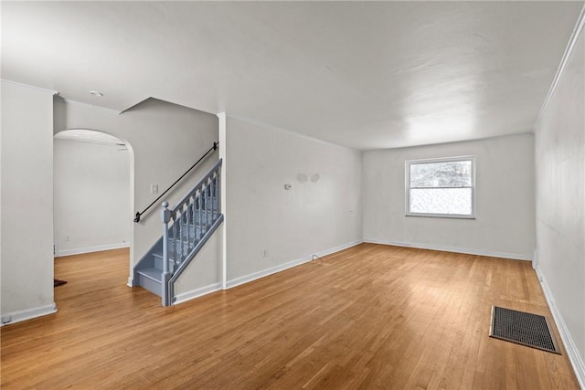 empty room with light hardwood / wood-style floors