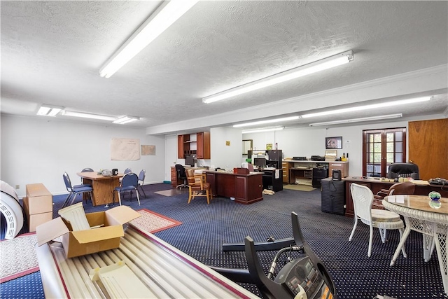 misc room with carpet and a textured ceiling