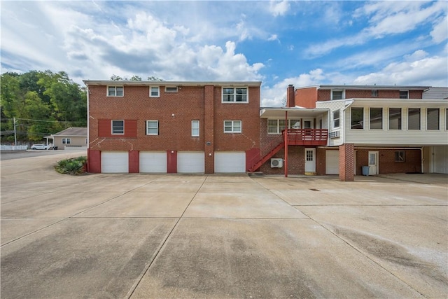 exterior space featuring a wooden deck and a garage