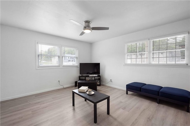 living room featuring ceiling fan and light wood-type flooring