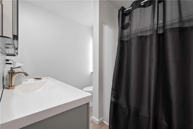 bathroom with vanity and toilet