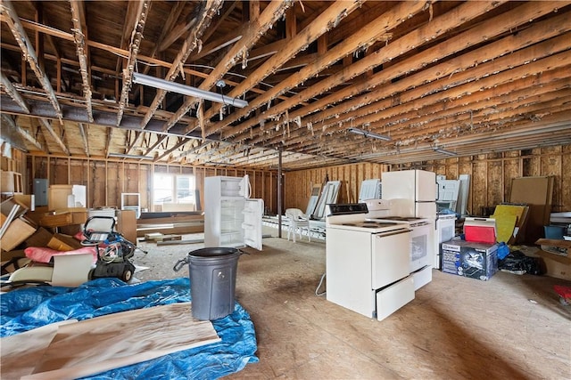 basement featuring electric panel and washer / clothes dryer