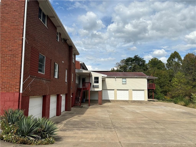 view of side of home with a garage