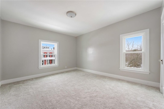 empty room featuring light colored carpet