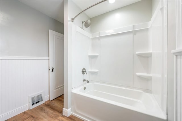 bathroom featuring shower / bathtub combination and wood-type flooring