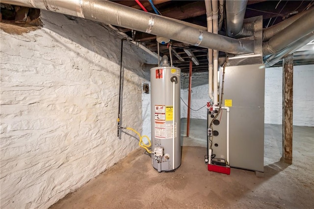 utility room with heating unit and water heater