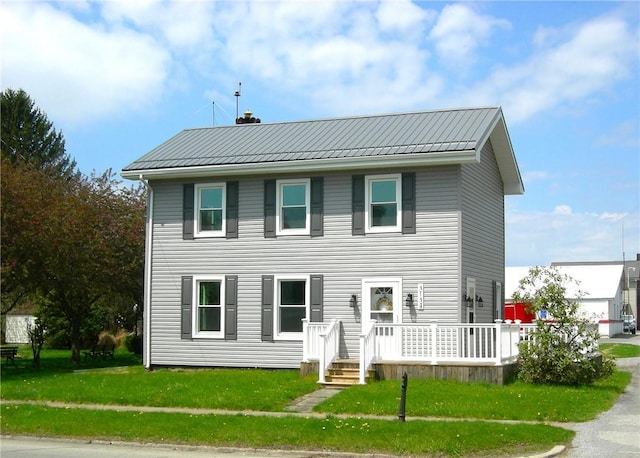 3134 Main St, West Middlesex Boro, PA 16159 - colonial-style house with a deck, a front yard, and metal roof