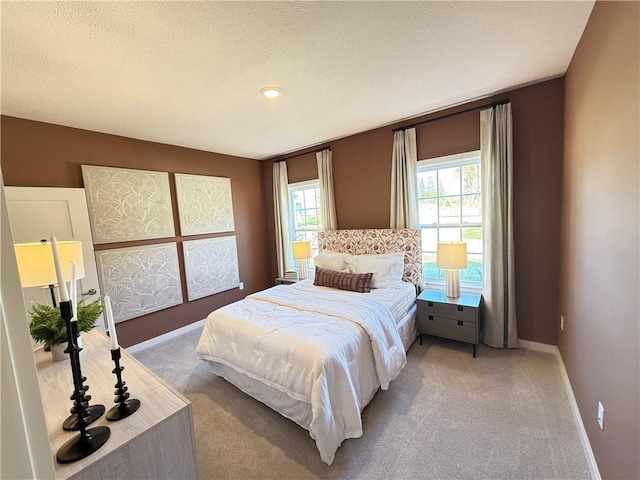 carpeted bedroom featuring multiple windows