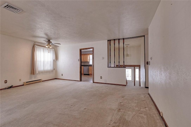 carpeted spare room featuring baseboard heating, ceiling fan, and a textured ceiling