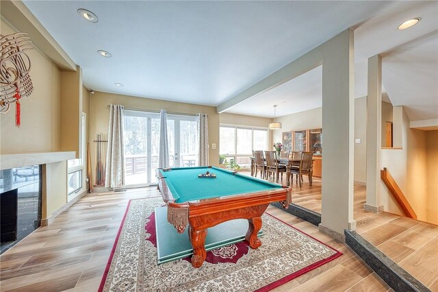 recreation room with light hardwood / wood-style flooring and billiards