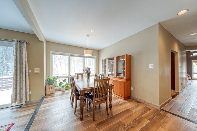 dining area featuring light wood-type flooring