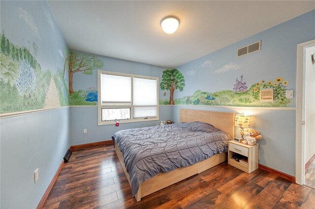 bedroom with dark wood-type flooring