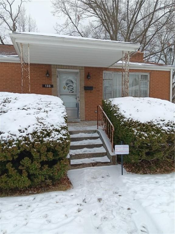 view of front of house with a carport