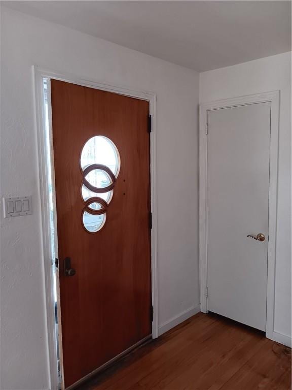 entryway with dark hardwood / wood-style floors